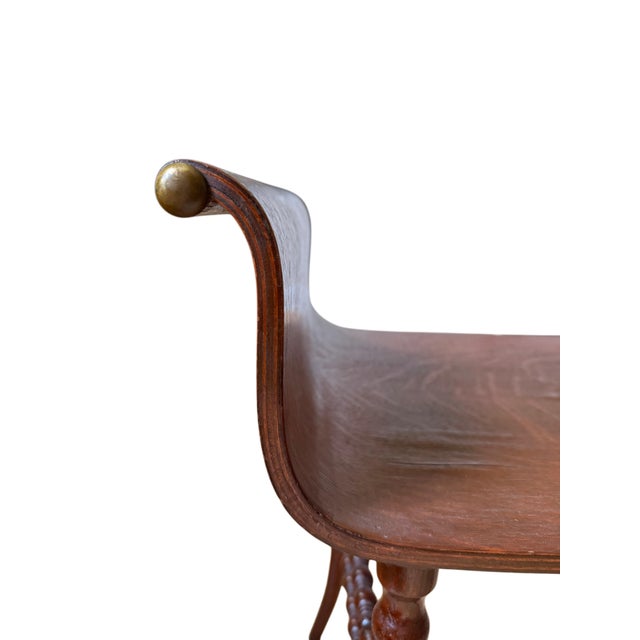 This striking, 19th-century-inspired vanity stool seamlessly blends sculptural elegance with master-class stability. Its...