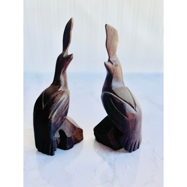 This exquisite pair of hand-carved ironwood crane sculptures captures the beauty and grace of these symbolic birds....