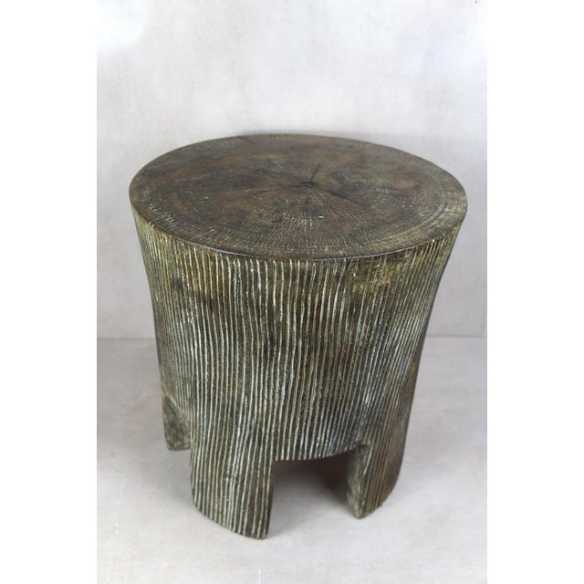 Introduce a touch of African elegance into your living space with this remarkable solid wood carved side table\.tool from...