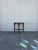 We have a vintage demilune console table for sale, featuring a classic half moon shape, warm wood finish, turned and...