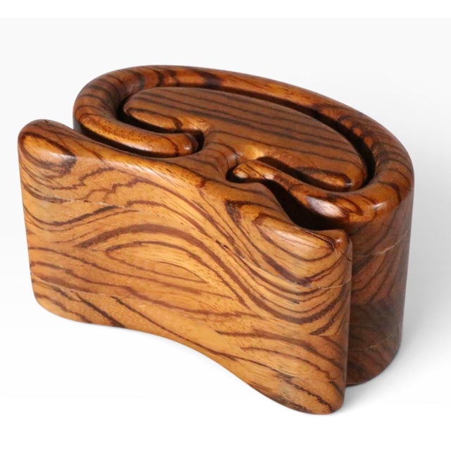 Classic Organic Modern craft made wood box, by noted woodworker Richard Rothbard, circa 1970's. The box features a...