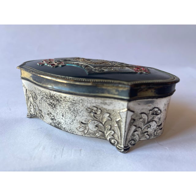Japanese silvered metal jewellery box with enamelled top design of Mount Fuji, a dragon and flowers surrounding. The...