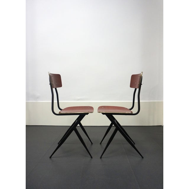 Pair of Italian chairs, 1950s design. This stylish pair of chairs, with their metal frames and Formica seats and backs,...