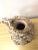 Extraordinarily detailed seashell encrusted ceramic pitcher with a grapevine design made of shells including seed shell....