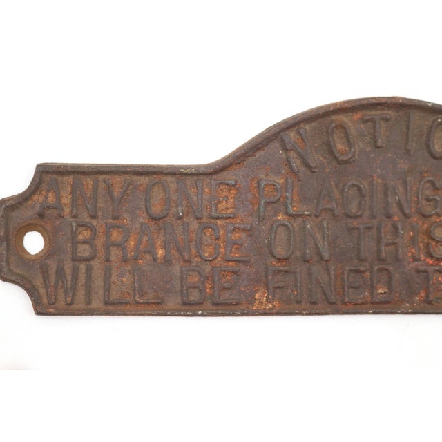 Reclaimed cast iron balcony notice plate that reads, "Notice Anyone Placing Any Encumbrance On This Balcony Will Be Fined...