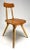 Set of two wooden "Pirkka" chairs, masterfully designed by the revered Ilmari Tapiovaara for Laukaan Puu. Hailing from the...