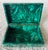 Malachite, a semi precious stone, not only makes a beautiful accessory to look at, but is also useful as a hinged catchall...