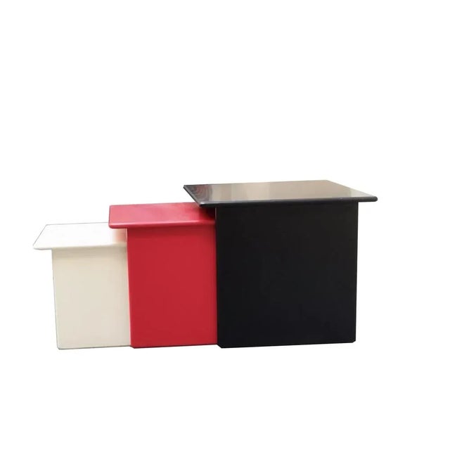 Wonderful set consisting of 3 stackable coffee tables for living room entirely made of lacquered wood, black,red and white.