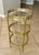 French smaller scale round three-tier brass side or end table with glass shelf insets. Nice detailing including reeded...