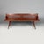 Italian Art Deco bench in red wood, 1930s Bench or display stand in burgundy-red painted wood. The rectangular backrest...