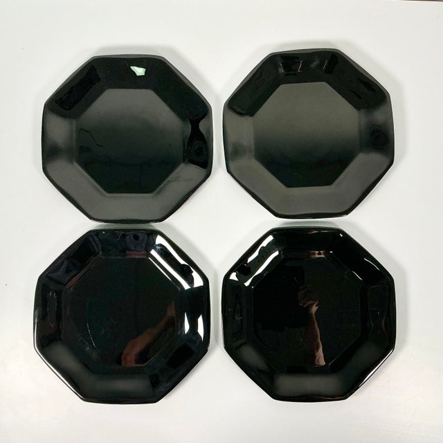 This set of 4 French Octagonal Black Glass Dinner Plates are from the 1980s. The contemporary postmodern design is by...