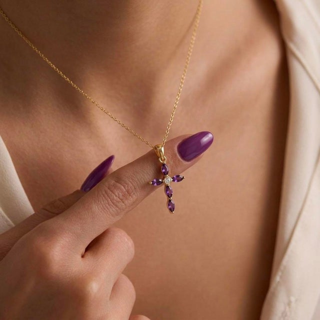 Combine timeless elegance with spiritual significance in this beautiful Marquise Amethyst Cross Necklace. This delicate...