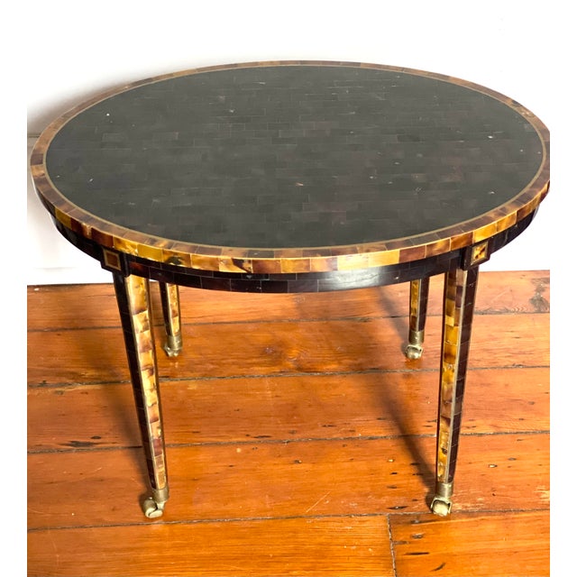 Maitland Smith Tessellated Faux Tortoise Shell oblong side table w Brass inlay, on brass wheels. Hand made in Cebu,...