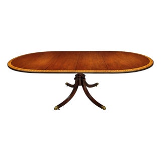 English Regency Revival Flame Mahogany Oval Extension Dining Table With Satinwood Crossbanding and Brass Paw Feet, Circa 1935 For Sale