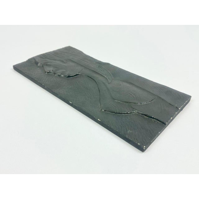 The bas-relief has an illegible signature of the author "Ruda 66". This piece has an attribution mark, I am sure that it...