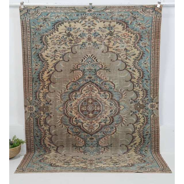 Vintage Hand-Knotted area rug is a semi-antique vintage area rug. The '70s Eastern region of Anatolian's unique rug is...