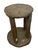 This decorative stool or low pedestal features a cylindrical, four-leg form with a round top and base, all clad in thin...