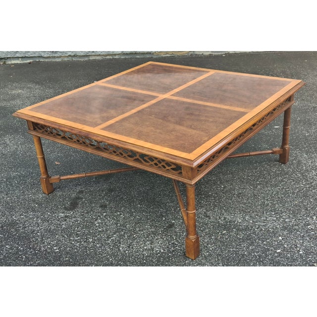 Thomasville Chinese Chippendale Cross-Banded Mahogany Faux Bamboo Coffee Table. Measures 38" in width, 38" in depth and...
