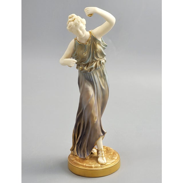 A Royal Worcester porcelain figure of a dancing woman from the established “Grecian Maiden” series, model 1827, dating to...