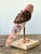 Elevate your coastal or bohemian interior with this enchanting vintage shell-encrusted bird sculpture. Meticulously...