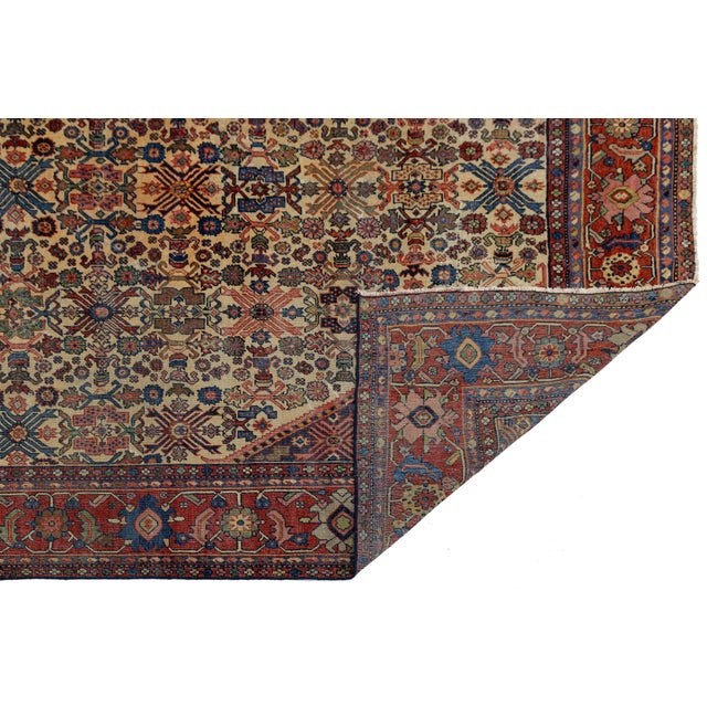 Add a touch of historic elegance and unmatched durability to your space with this stunning Antique Bidjar Rug. Hand-woven...