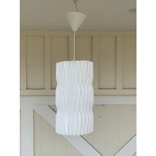 Inspired by the cross-pleating technique used in Kaare KlintÂ’s Fruit lamp, Tove and Edvard Kindt-Larsen were inspired to...