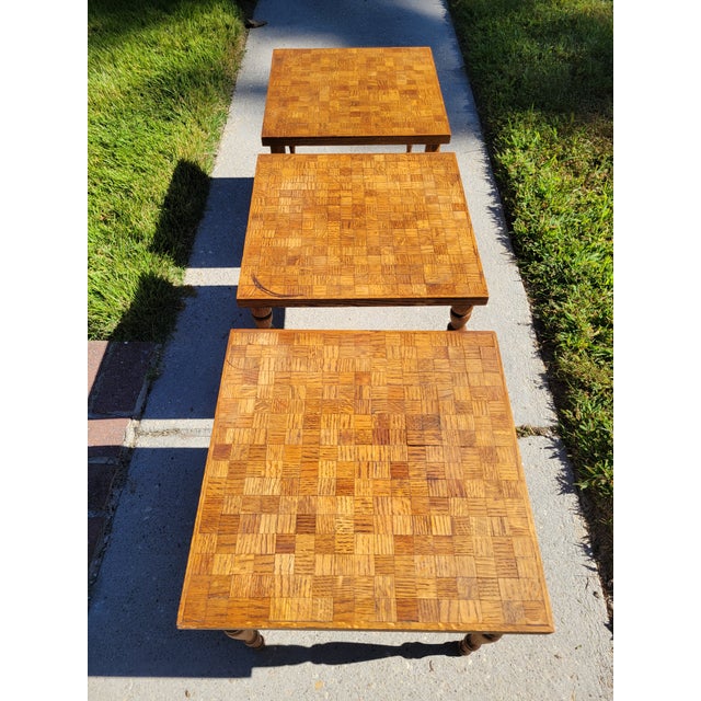 Set of three small oak parquet tables with turned legs. Can be used inside or outside as cocktail tables or plant stands....