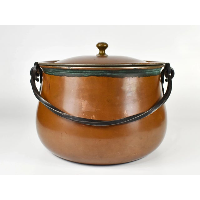 Unique German made lidded copper pot with hand forged metal handle is a great piece to display at kitchen, to enhance your...