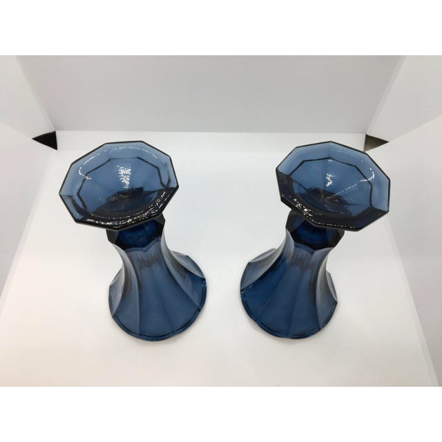 A beautiful pair of vintage Fostoria Dark Blue Glass vases. These flower vases were made by the Fostoria Glass Company....