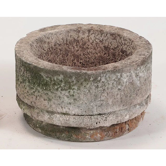 A pair of round French stone planters circa 1950. Ht: 18.5" x Wd: 24"