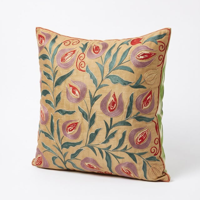 This beautiful hand embroidered suzani fabric is sourced from Uzbekistan. We cut and sew the pillow by hand in our Houston...
