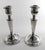 A striking and elegant pair of mid-century sterling silver candlesticks, masterfully crafted in Spain during the 1950s....