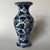 A single small antique Chinese export porcelain vase featuring hand painted traditional cobalt blue floral decoration.