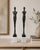 Statement pair of elongated male and female figural sculptures in the style of Alberto Giacometti, each mounted on a...