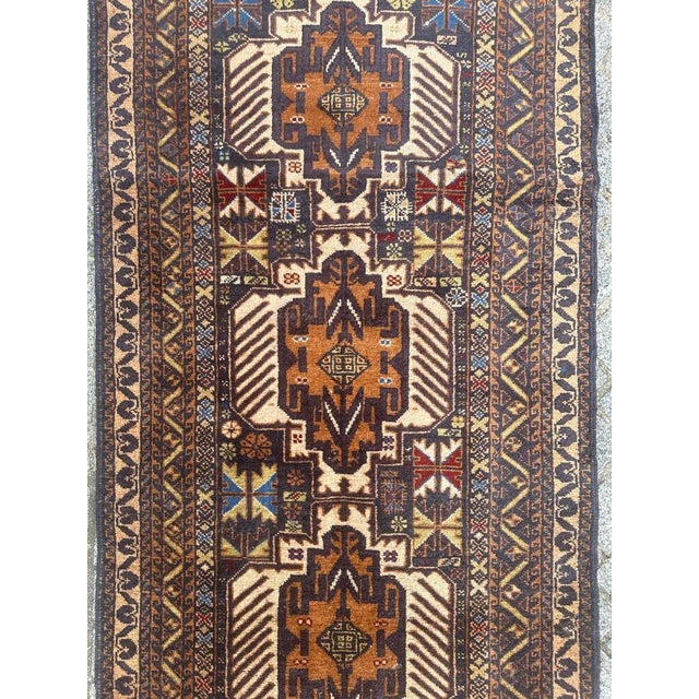 Nice mid century Turkmen Baluch Afghan rug with beautiful tribal design and nice colours with blue, orange, green and red,...