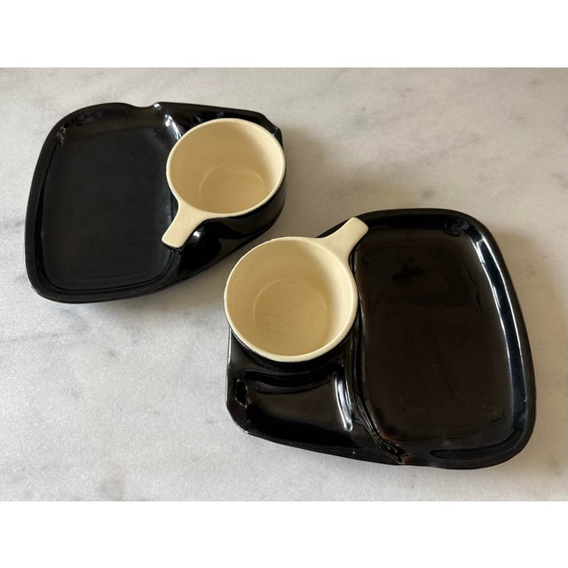 Pair of vintage mid century black and white glaze and ceramic "TV Set" or "Soup and Sandwich" combo dishes made by Rubel....