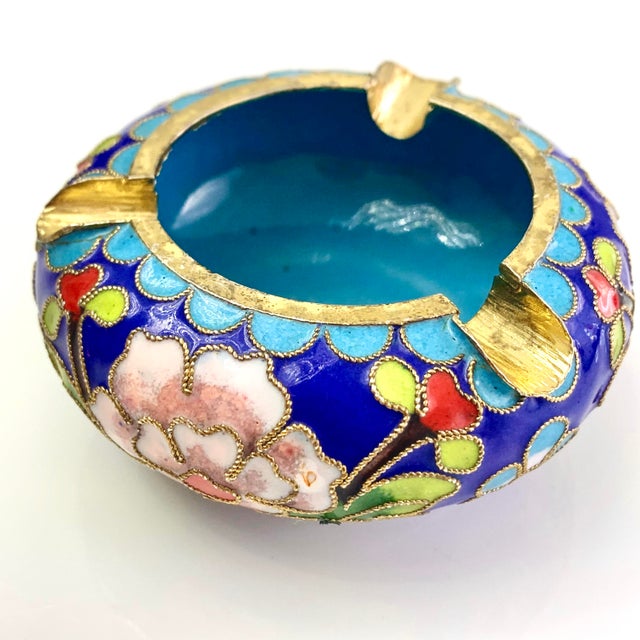 Vintage chinoiserie floral enamel Cloisonne ashtray. Remarkable workmanship goes into crafting the hand-wrought metal and...