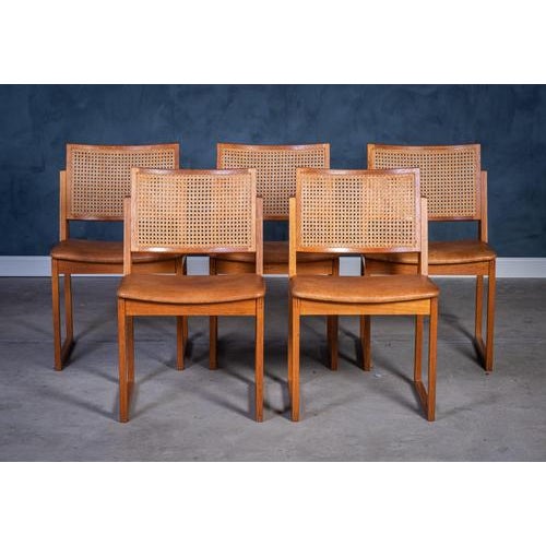 Set of five elegant dining chairs designed by Kai Lyngfeldt Larsen in the 1960s. Crafted in solid oak with handwoven...