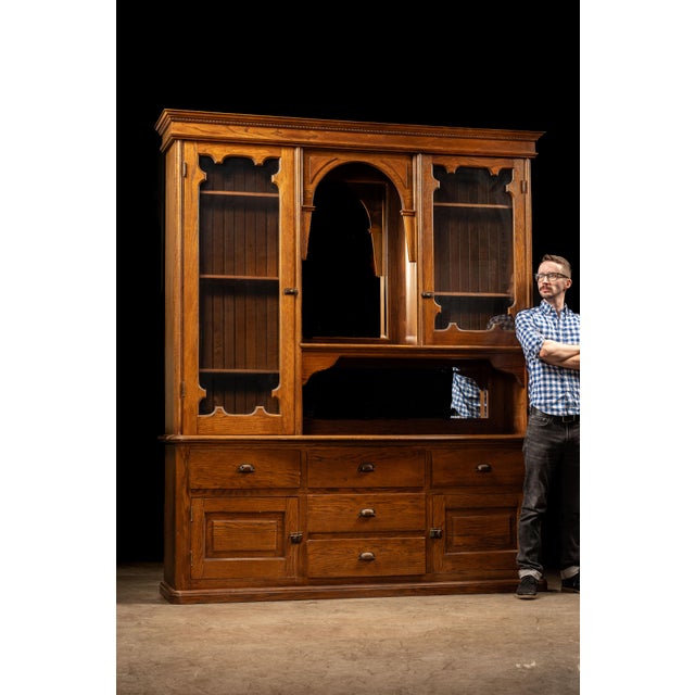 Substantial quarter-sawn oak hutch cabinet combining display, storage, and work surface functions in a form well suited to...