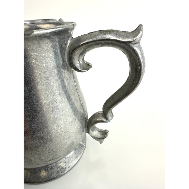 This set of antique pewter beer mugs exudes a rustic charm and old-world craftsmanship. Each mug, with its sturdy handle...