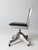 This mid-century modern Shaw-Walker swivel desk chair features an aluminum base with casters, a curved wood back, and a...