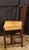 An early 19th century Italian rustic neoclassical side chair. Square back with carved urn backsplat. Rush seat in good...