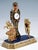 Ornate viennese belle époque table clock in gilt silver with enamel and gemstone inlay, set on a rectangular stepped base...
