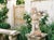A French terracotta garden statue of a cherubic child holding a flower basket. Good condition with fading white paint and...
