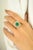 Make a bold statement with this stunning 18K yellow gold ring, showcasing a vibrant 2.06 carat emerald-cut emerald as its...