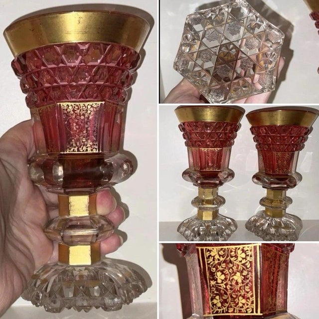 A rare and highly decorative pair of mid-19th-century Bohemian ruby cut-to-clear glass goblets, dating to circa 1840 and...