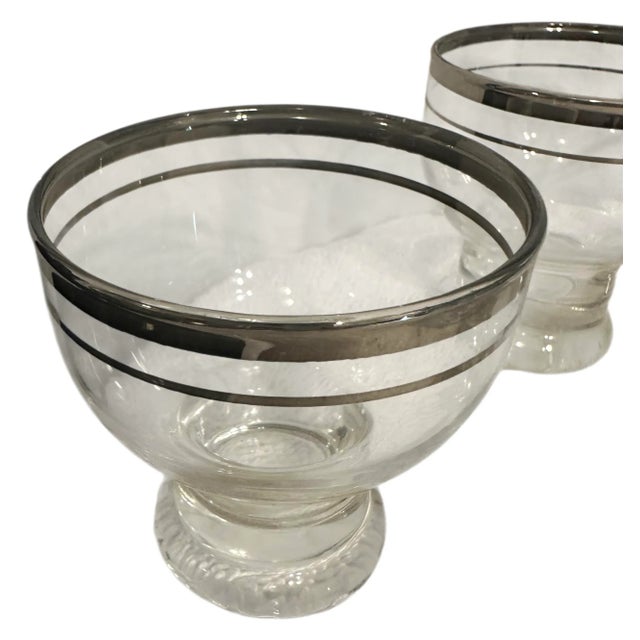 These cocktail glasses were produced by Javit Crystal in the 1950s as part of their 'Young Love' pattern, characterized by...