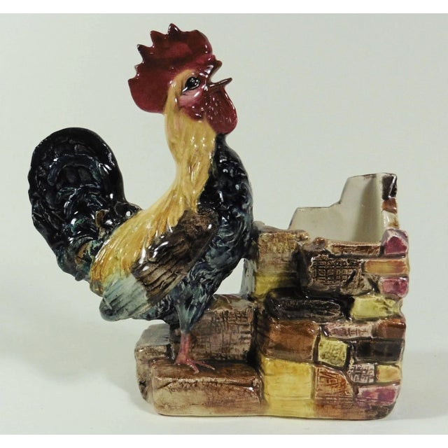Lovely colorful Majolica rooster jardiniere laying on a pink and brown wall attributed to Jerome Massier, circa 1890.