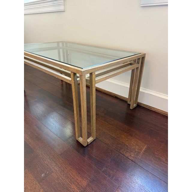 Gorgeous light wood stained glass top side table by renowned American designer Billy Baldwin. In excellent condition for...