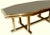 Impressive octagonal brass dining table by Maison Jansen. Floating top. Can be also used as a desk. 12 chairs can come...